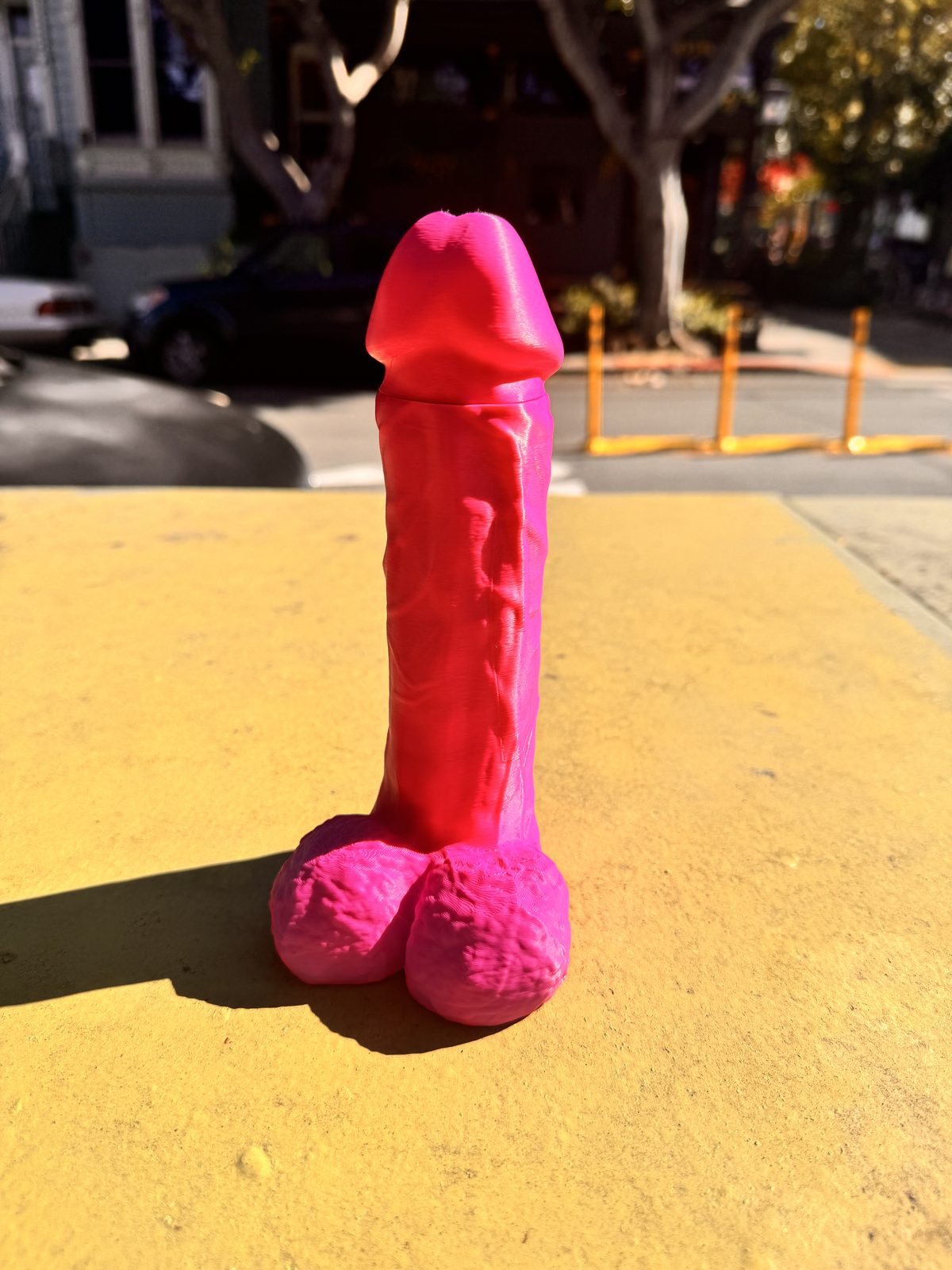 Pink Dickstendo standing on a box