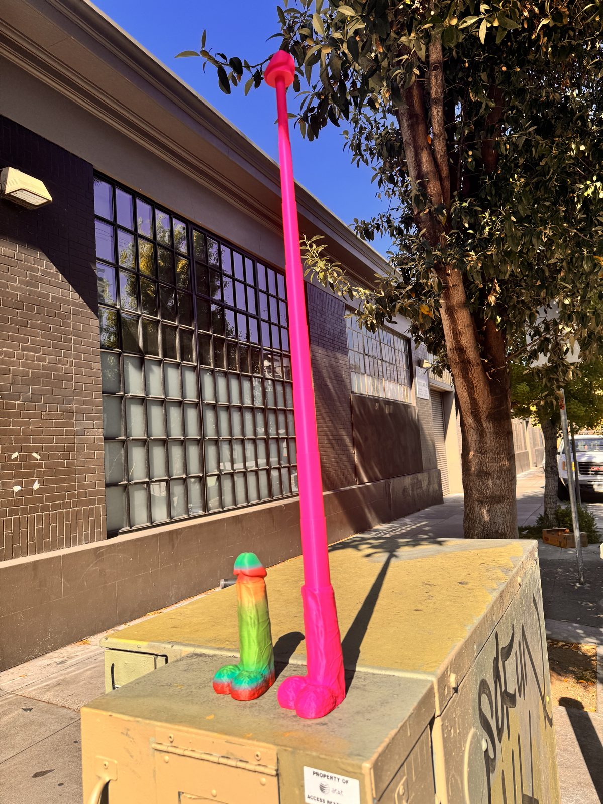 Tall pink and green Dickstendo outdoors